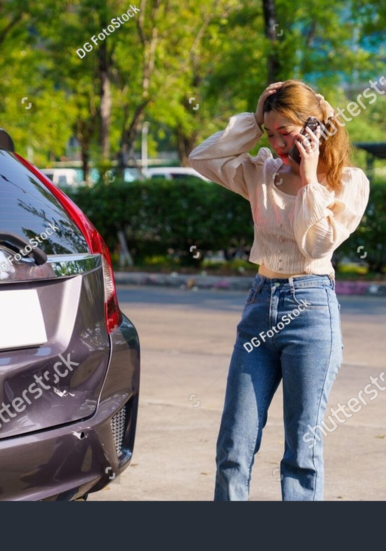 stock-photo-distressed-asian-female-calling-her-car-insurance-company-after-a-minor-crash-distressed-female-2772652355